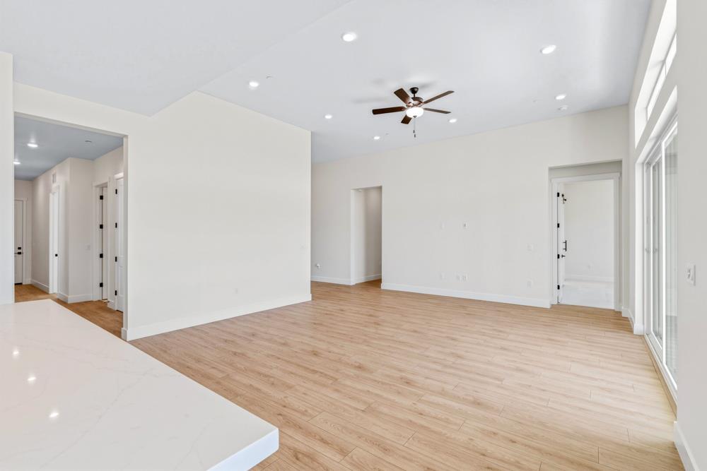 14838 Grace Warren Way Rancho Murieta, CA 95683 - Photo 5 of 22 a view of empty room with wooden floor and ceiling fan