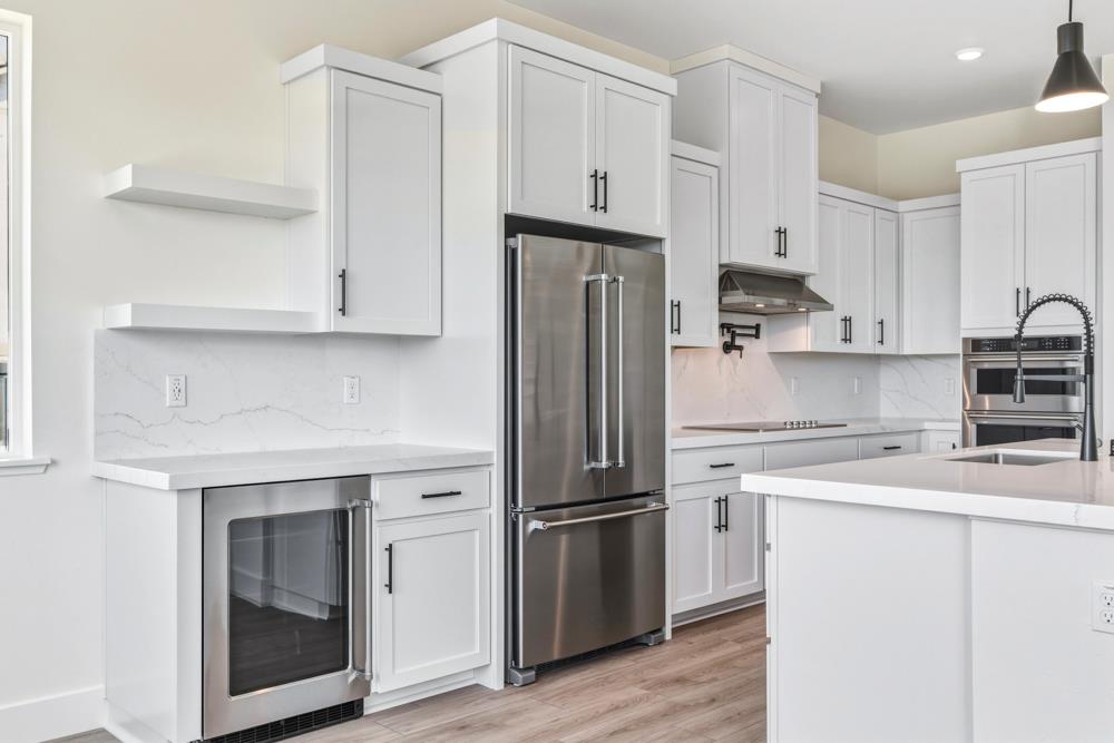 14838 Grace Warren Way Rancho Murieta, CA 95683 - Photo 10 of 22 a kitchen with cabinets stainless steel appliances and a counter space