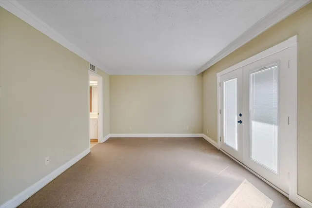 a view of an empty room and a window