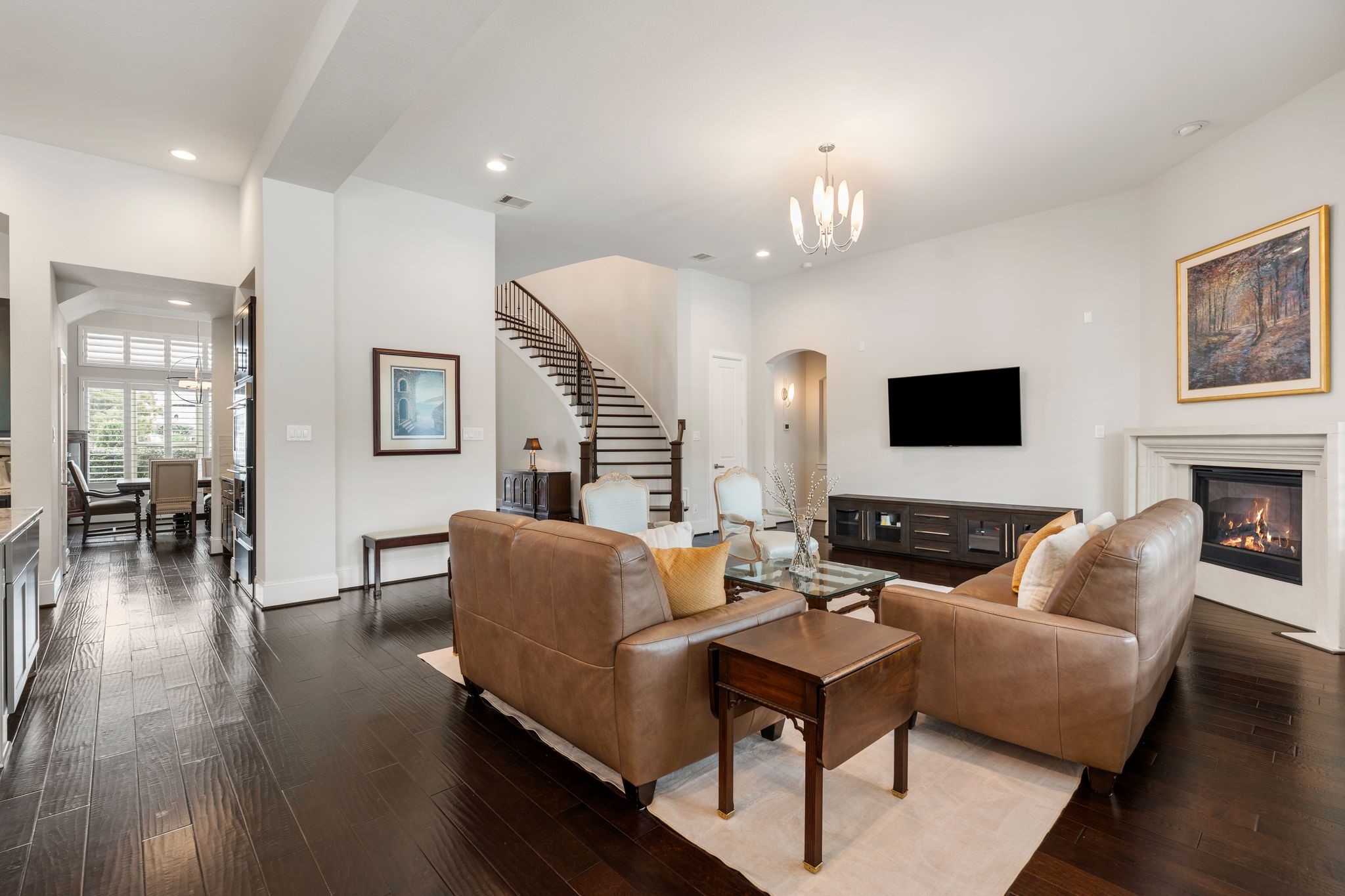 2926 Fairmont Ridge Lane Katy, TX 77494 - Photo 16 of 49 a living room with furniture a fireplace and a flat screen tv