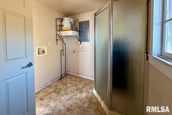 a view of a living room with furniture and a window