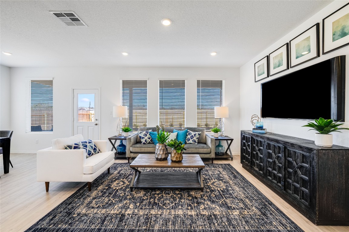 1819 Bear Grass Rdg Road Temple, TX 76501 - Photo 6 of 23 Living room featuring light wood finished floors and recessed lighting
