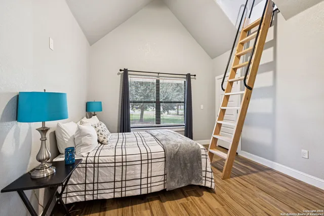 a living room with furniture and a ceiling fan