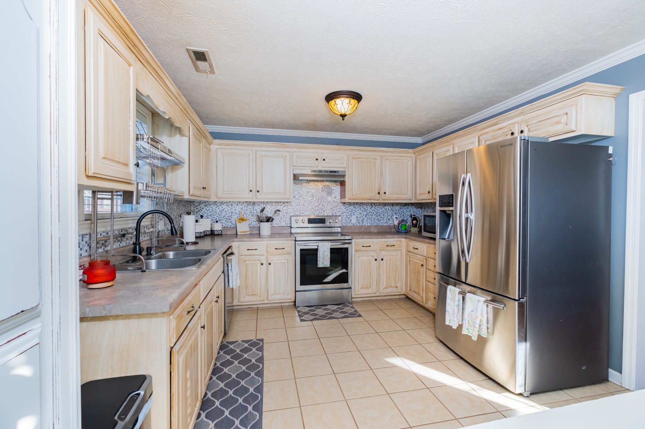 118 Hamilton Court Manchester, TN 37355 - Photo 11 of 33 a kitchen with a refrigerator sink and cabinets