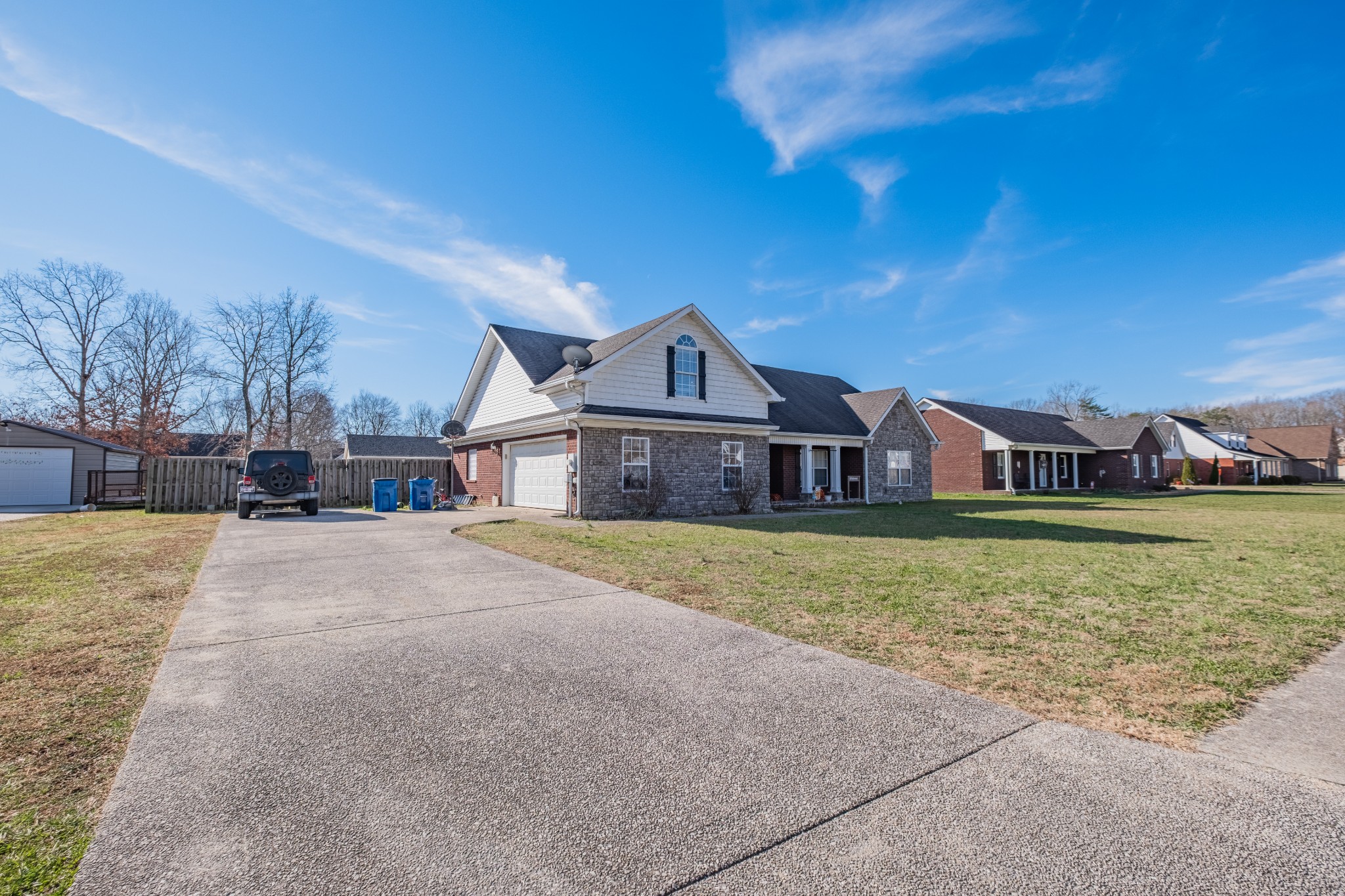 118 Hamilton Court Manchester, TN 37355 - Photo 33 of 33 a front view of a house with a yard and large trees
