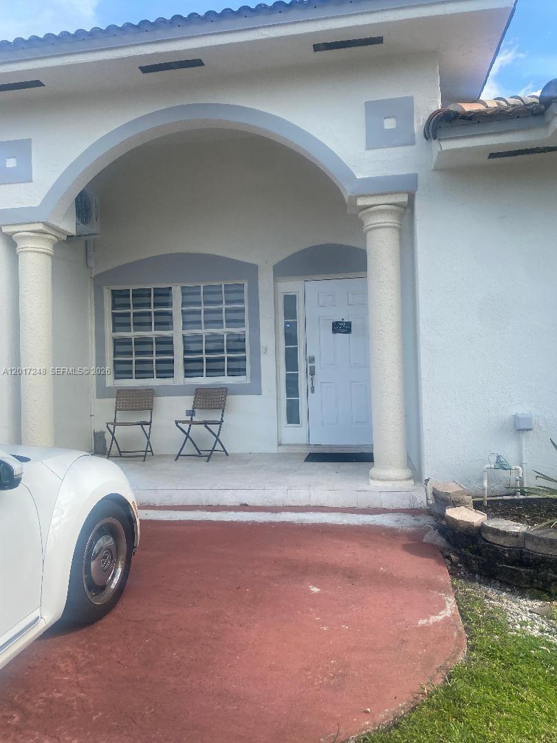 14640 Southwest 180th Street Miami, FL 33177 - Photo 2 of 6 a view of a livingroom with car parked