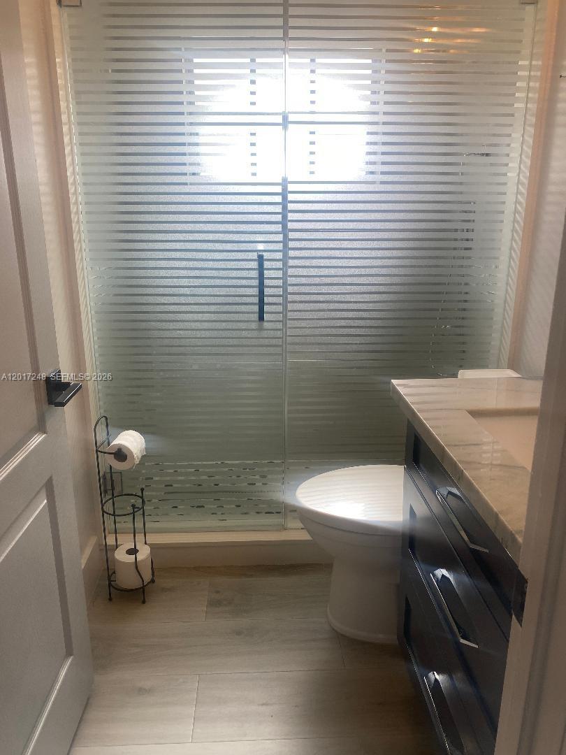 14640 Southwest 180th Street Miami, FL 33177 - Photo 5 of 6 a bathroom with a toilet and a sink