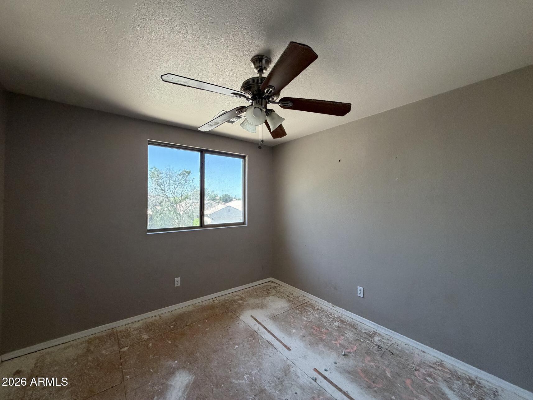 10807 West Monte Vista Road Avondale, AZ 85392 - Photo 33 of 33 a view of a ceiling fan and a window