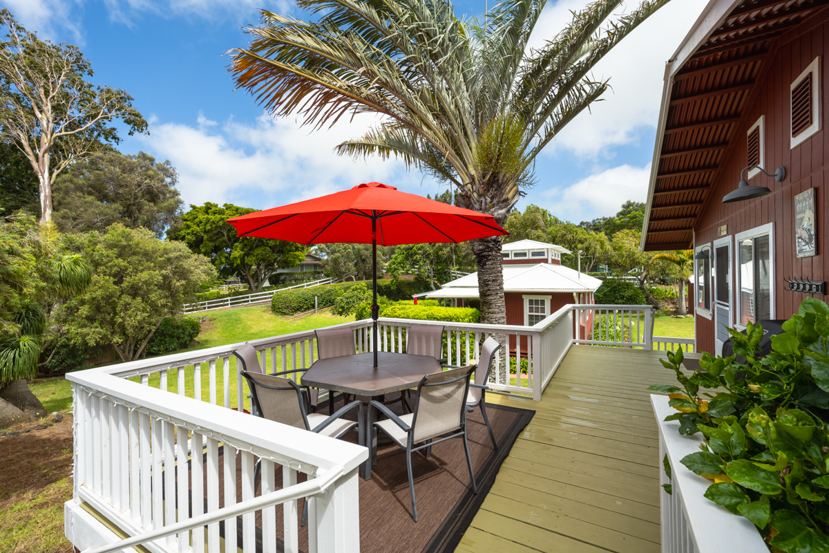 66-1685 Kohala Mountain Road Kamuela, HI 96743 - Photo 13 of 26 a view of balcony with outdoor seating and wooden floor