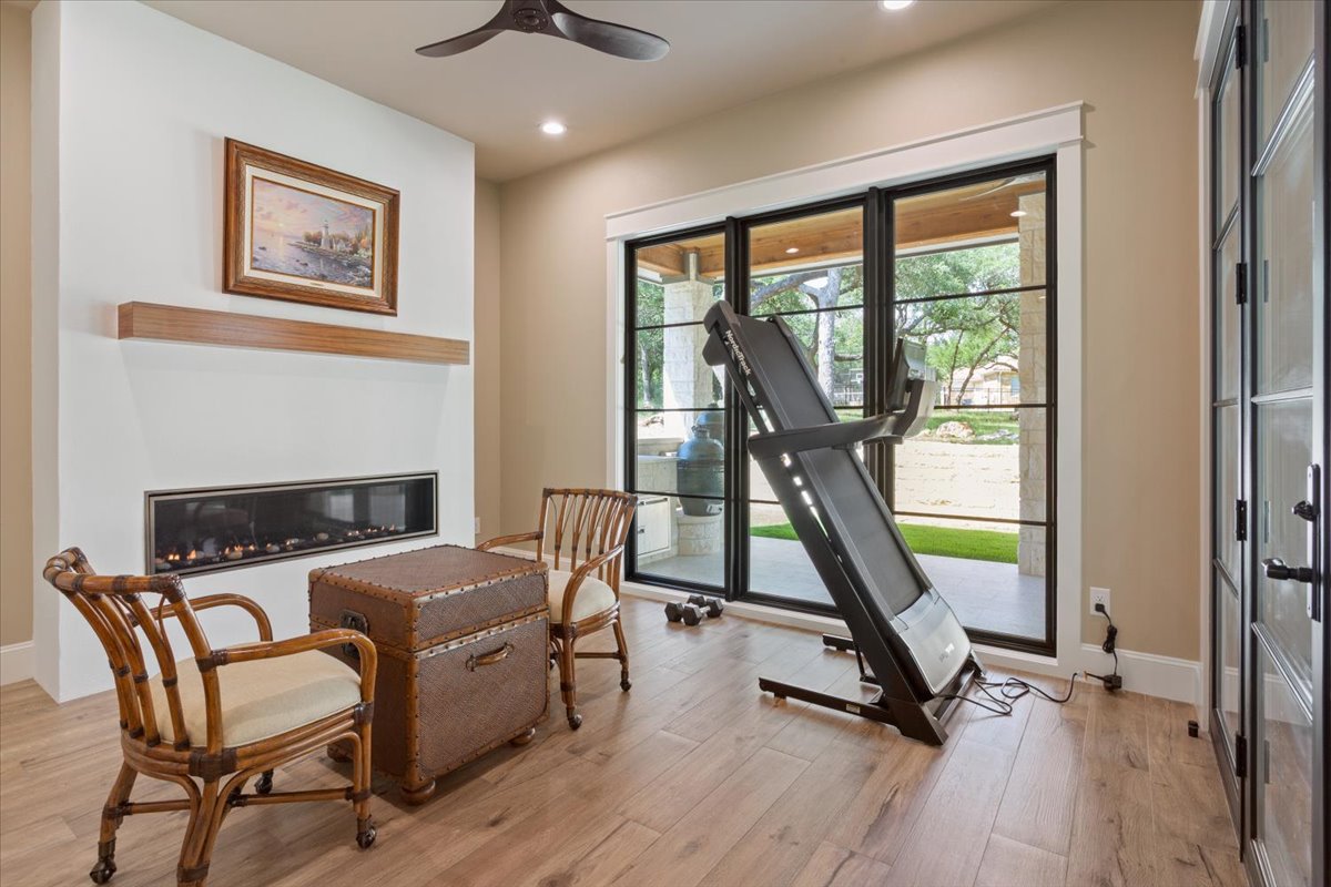 309 Highland Spring Lane Georgetown, TX 78633 - Photo 19 of 40 This is the any & everything room again...Could also be used for a breakfast area or exercise room. Electric built in fireplace with Walnut mantle...