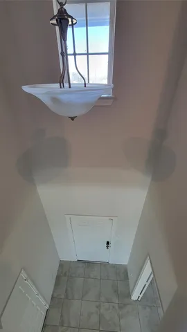 a view of empty room with windows