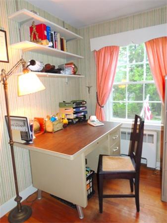 281 Lexington Road Concord, MA 01742 - Photo 11 of 16 a room with a wooden table chairs and a refrigerator