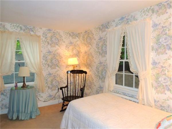 281 Lexington Road Concord, MA 01742 - Photo 6 of 16 a bedroom with a bed and a window