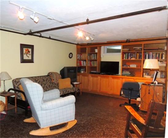 281 Lexington Road Concord, MA 01742 - Photo 10 of 16 a living room with furniture and a flat screen tv