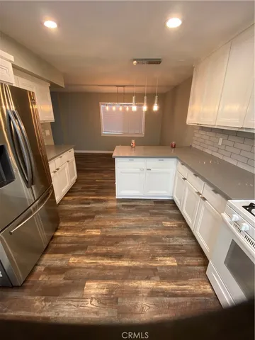 a view of a kitchen with a sink