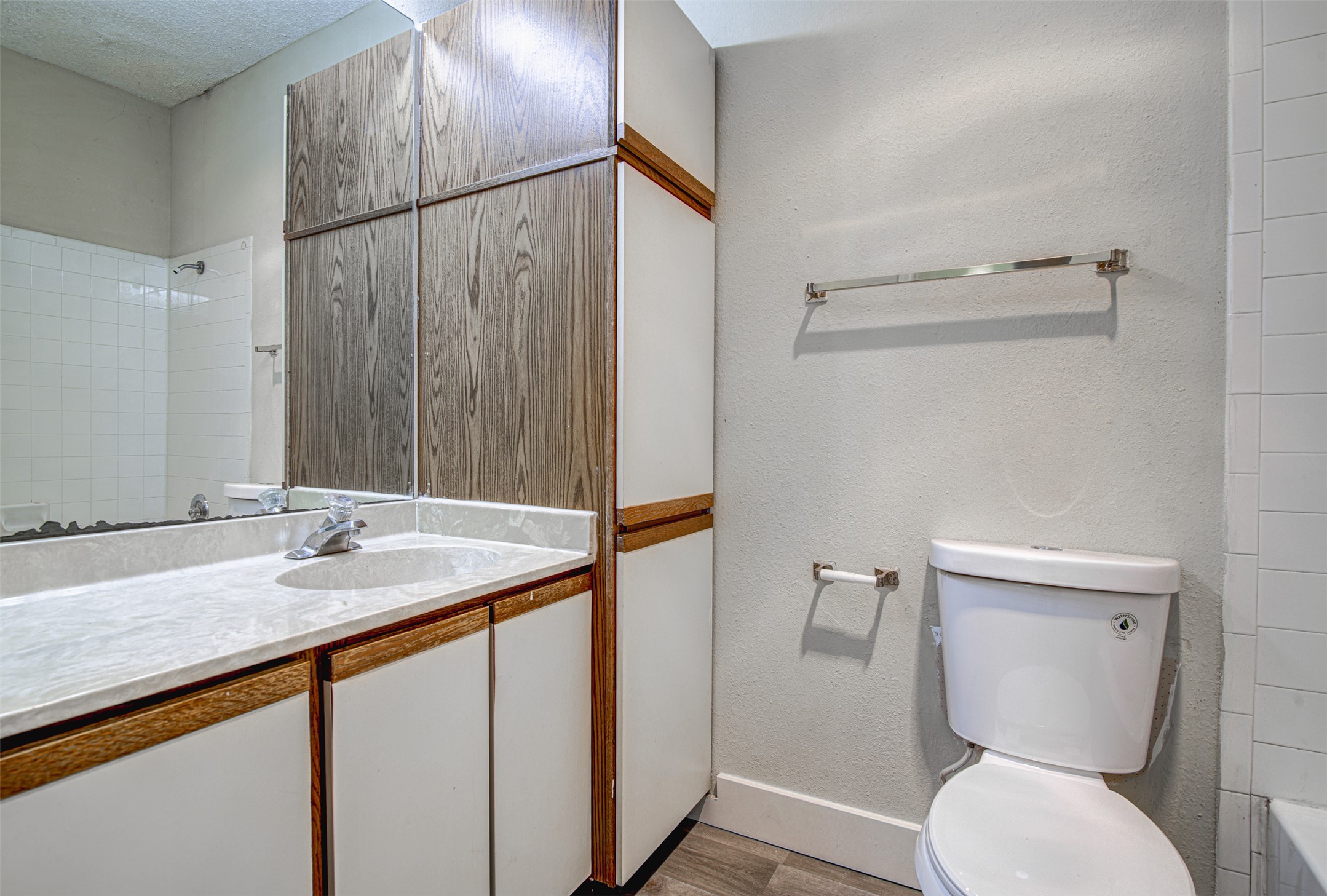 2804 Rio Grande Street, Unit 208 Austin, TX 78705 - Photo 17 of 24 Functional bathroom featuring a vanity with a single sink, built-in storage, and a shower/tub combination.
