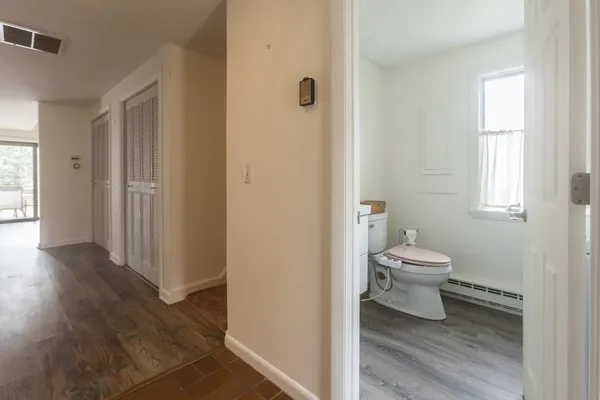 a white toilet sitting next to a bathroom sink
