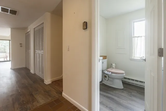 a white toilet sitting next to a bathroom sink