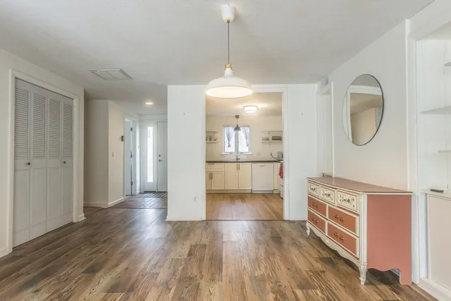a view of a kitchen cabinets and wooden floor