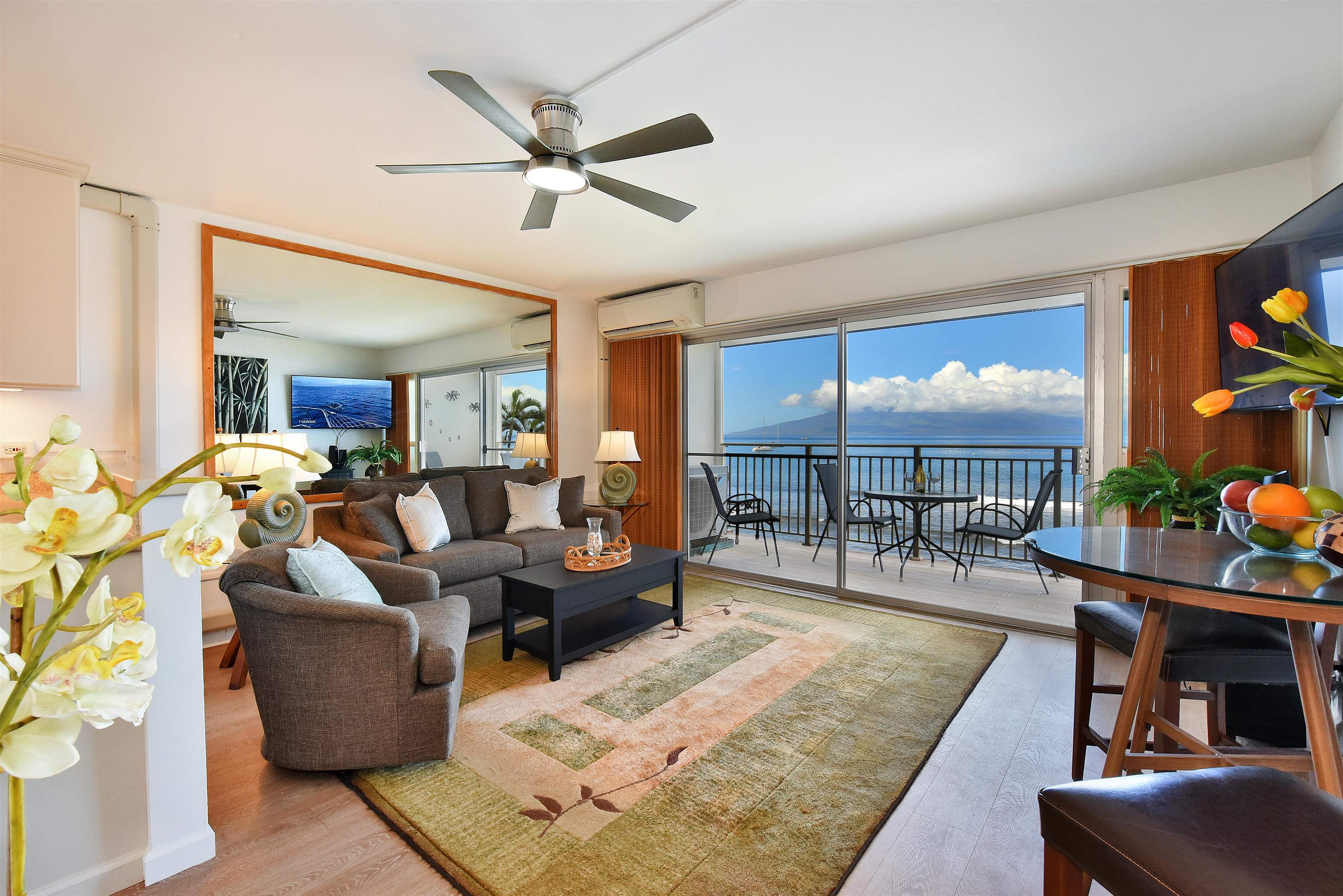 1403 Front Street, Unit 308 Lahaina, HI 96761 - Photo 8 of 35 a living room with furniture and a large window