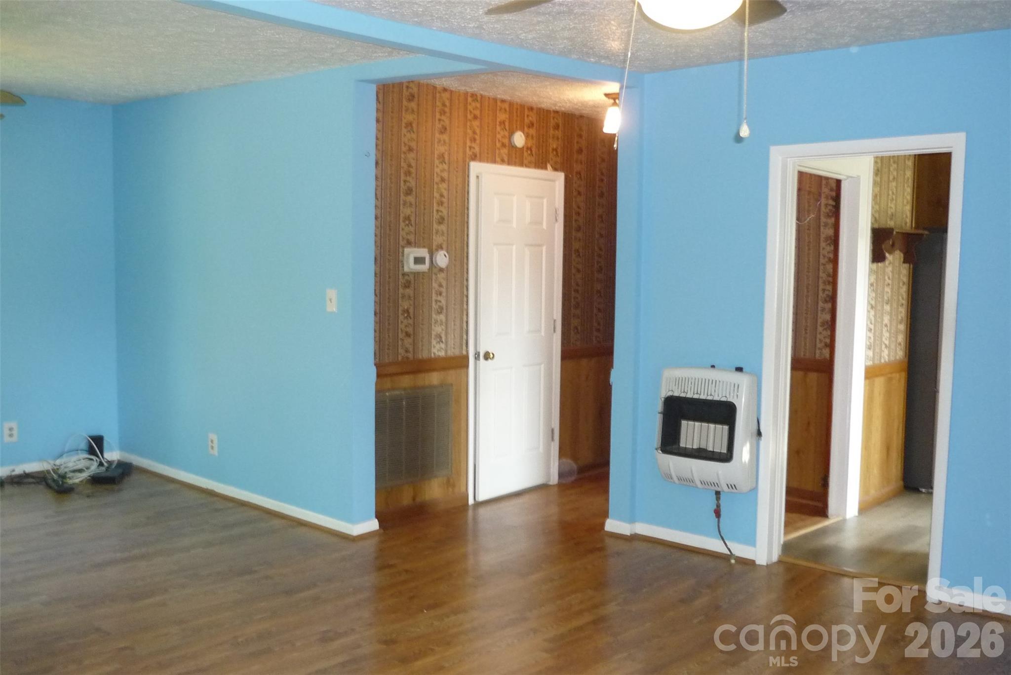 120 Bradley Road Shelby, NC 28152 - Photo 20 of 42 a view of a hallway with wooden floor and a fireplace