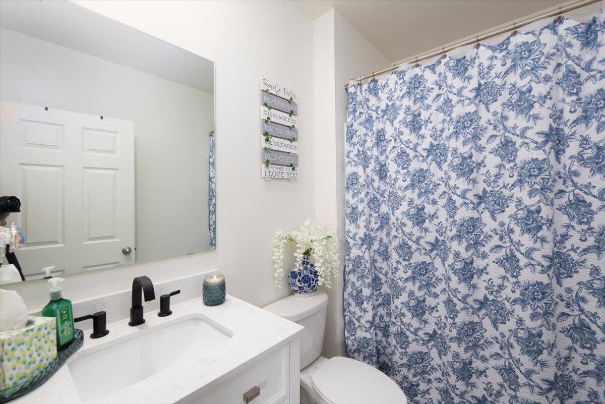 12314 Rimini Way Port St. Lucie, FL 34987 - Photo 23 of 49 a bathroom with a sink and a toilet