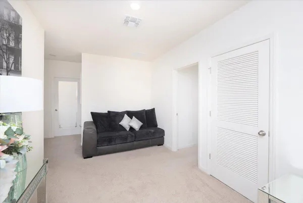 a bathroom with a granite countertop sink a toilet and shower