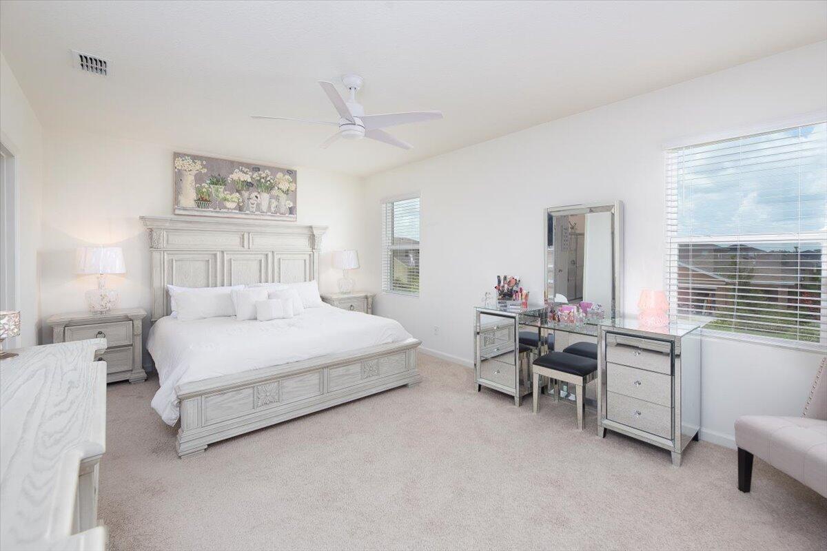 12314 Rimini Way Port St. Lucie, FL 34987 - Photo 26 of 49 a bed room with a bed and a chair