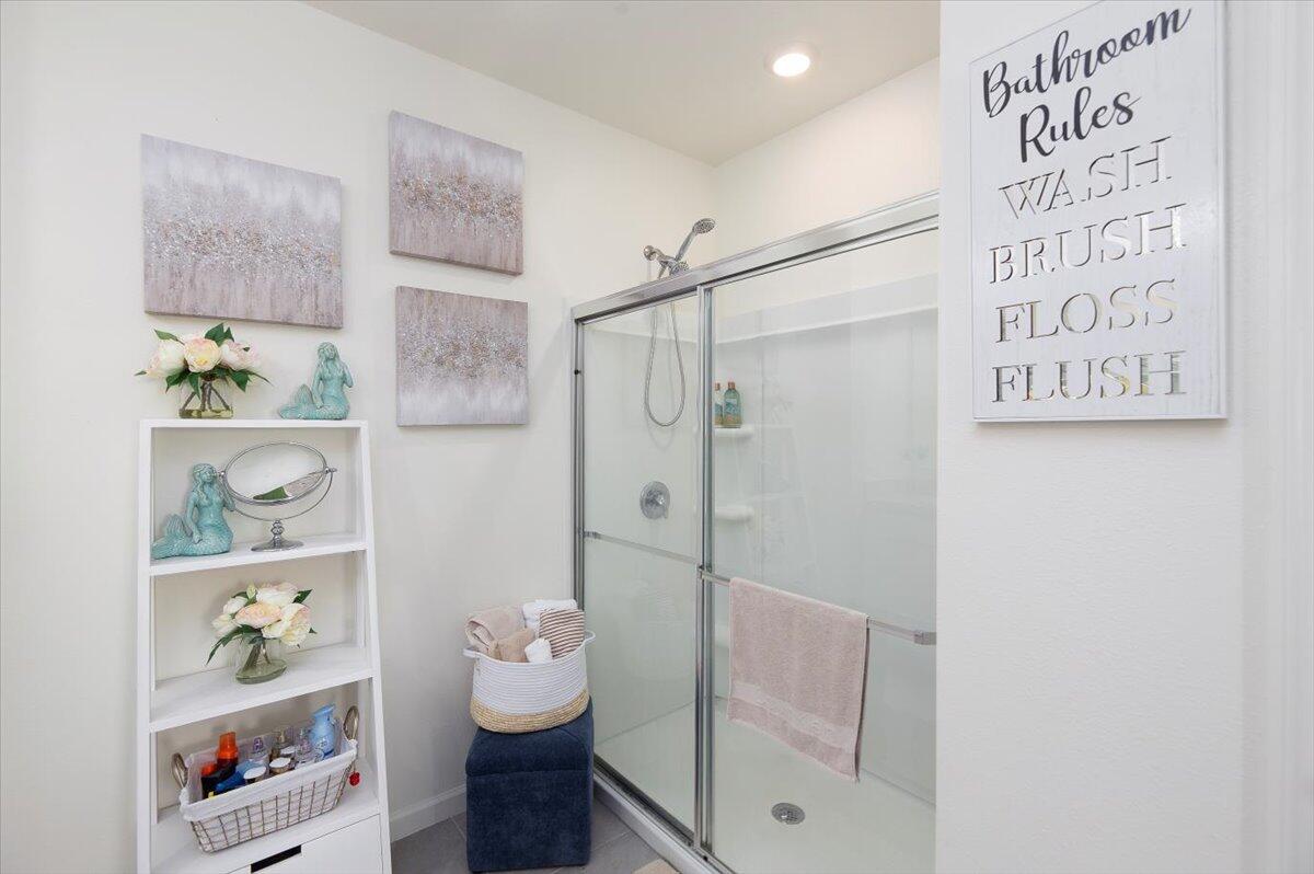 12314 Rimini Way Port St. Lucie, FL 34987 - Photo 31 of 49 a bathroom with a shower