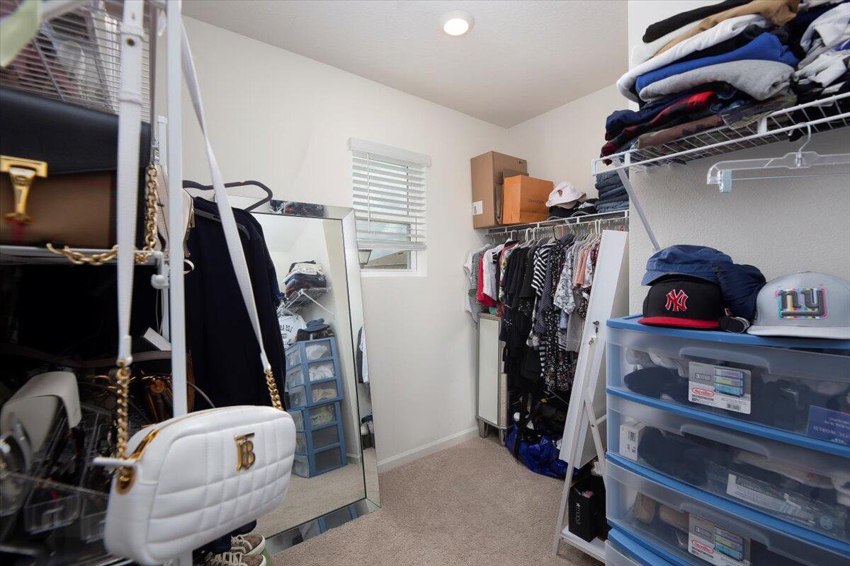 12314 Rimini Way Port St. Lucie, FL 34987 - Photo 32 of 49 a view of walk in closet with clothes and shoes