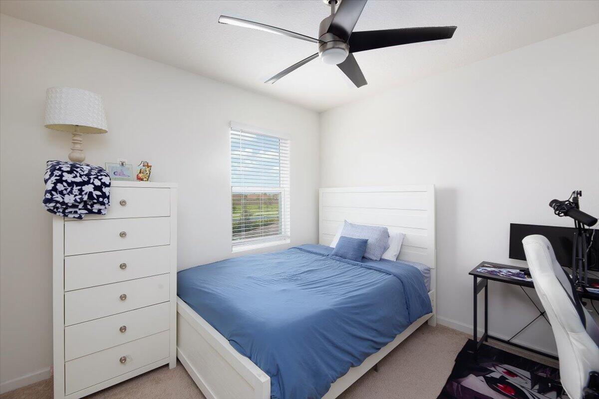 12314 Rimini Way Port St. Lucie, FL 34987 - Photo 35 of 49 a bedroom with a bed and a closet