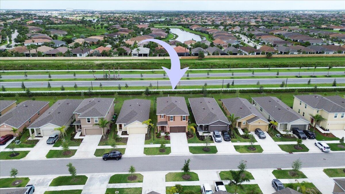 12314 Rimini Way Port St. Lucie, FL 34987 - Photo 40 of 49 an aerial view of multiple houses with yard