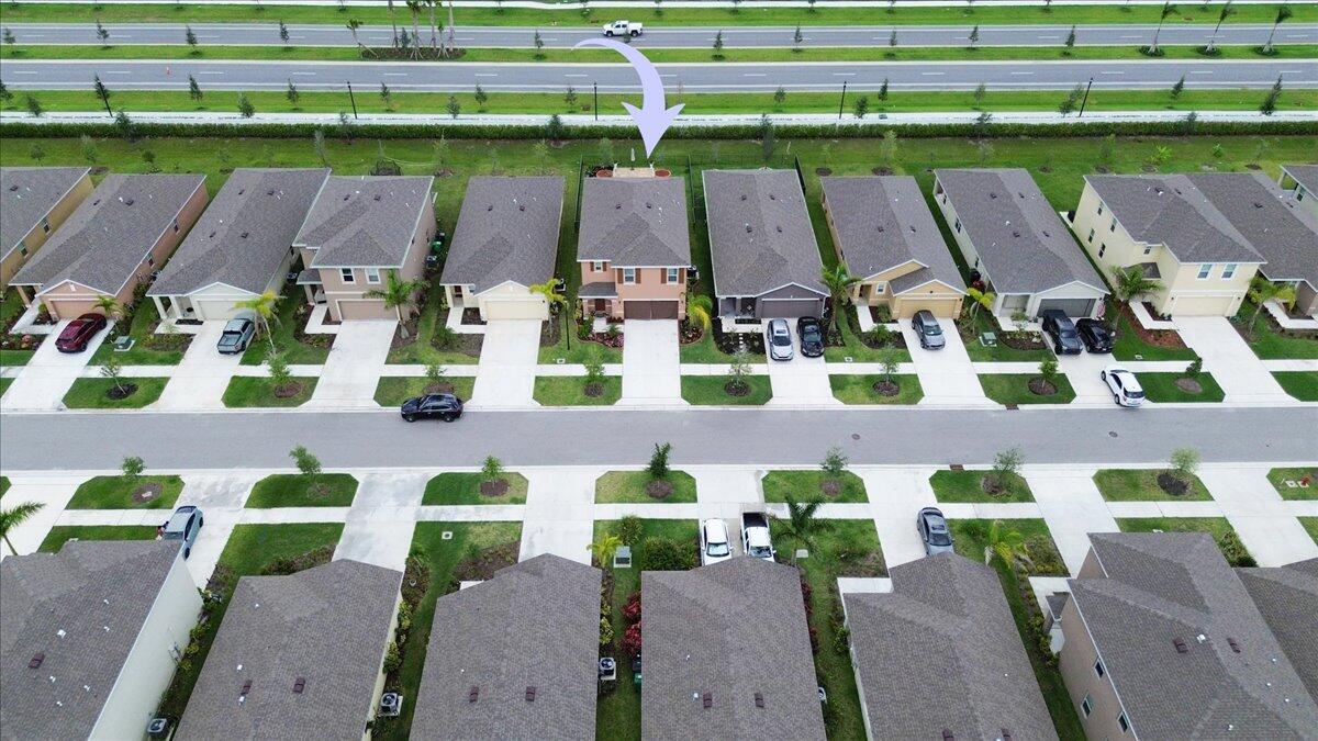 12314 Rimini Way Port St. Lucie, FL 34987 - Photo 46 of 49 an aerial view of multiple houses with outdoor space