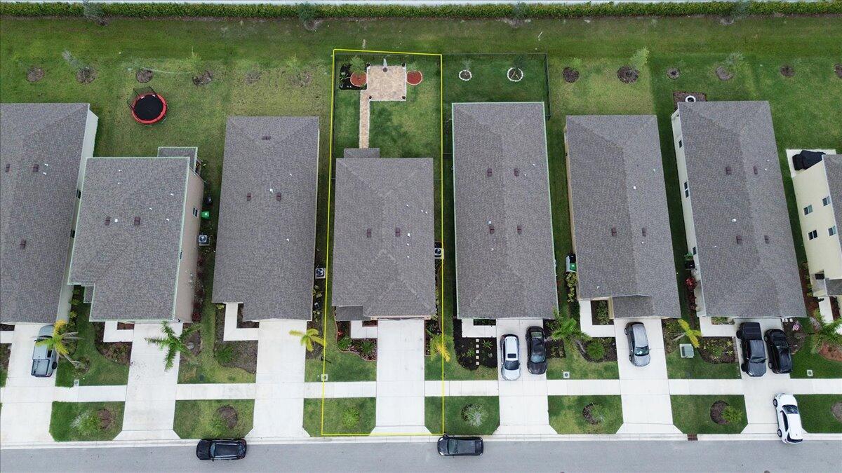 12314 Rimini Way Port St. Lucie, FL 34987 - Photo 47 of 49 an aerial view of a house with front yard and outdoor seating