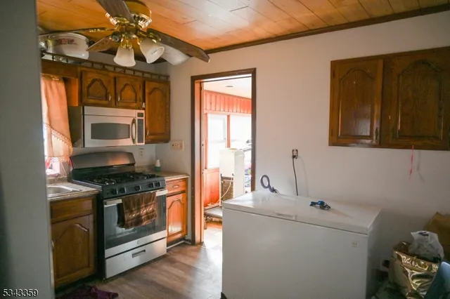 a kitchen with a stove and a microwave