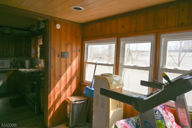 a couple of cars parked in front of a house