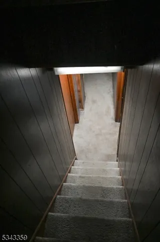 a bed room with a bed and a large window