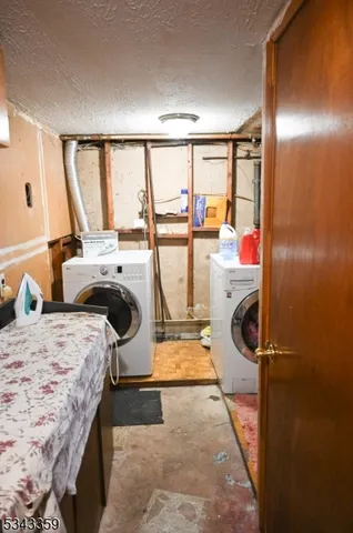 a bathroom with a toilet a sink and vanity