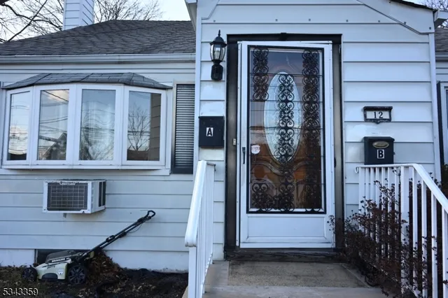 a front view of a house with a glass door