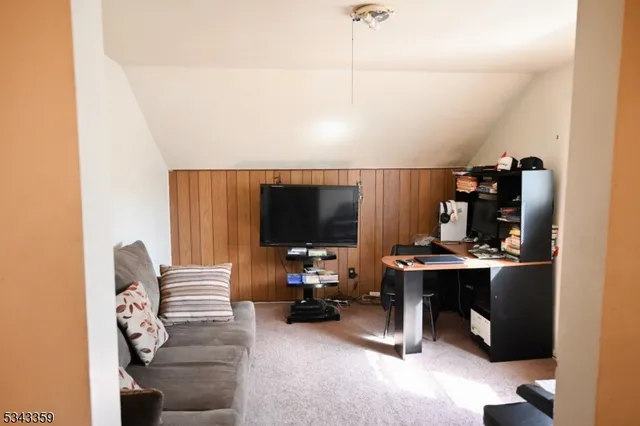 a kitchen with stainless steel appliances a stove a microwave and a cabinets