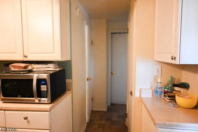 a bathroom with a sink toilet and a mirror