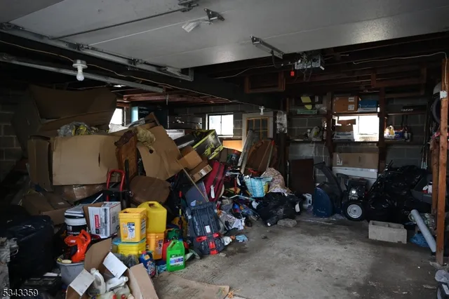 a car parked in front of white house