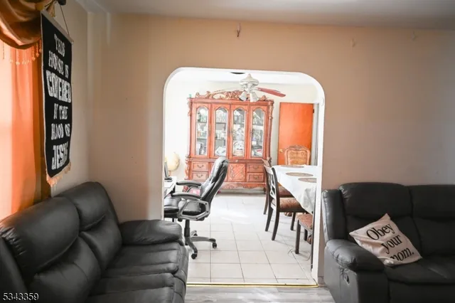 a view of a livingroom with furniture and floor to ceiling windows