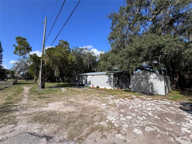 a view of backyard with green space