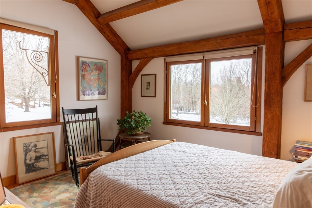 45 Sessions Road Hardwick, MA 01037 - Photo 14 of 28 a bedroom with a bed and a large window with outer view