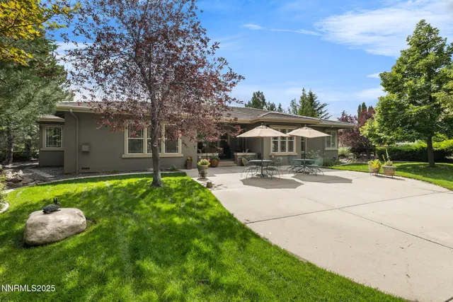 a view of a house with garden and yard