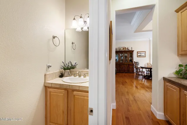 a en suite bathroom with a sink and mirror