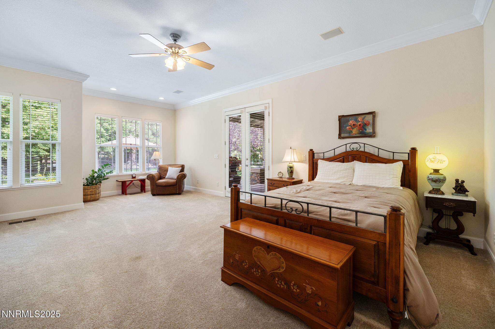 4865 Buckhaven Road Reno, NV 89519 - Photo 22 of 47 a bedroom with a bed and a chandelier