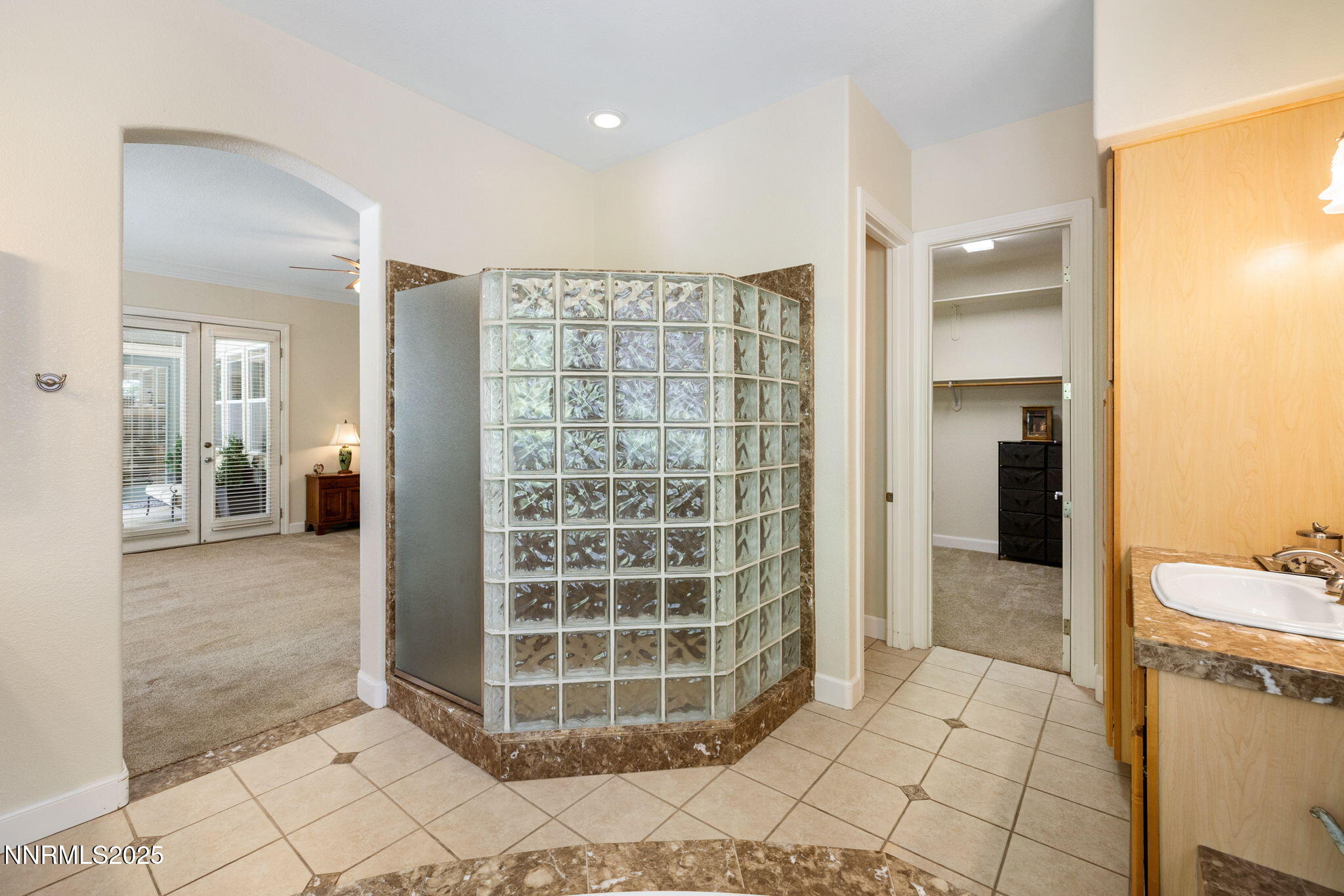 4865 Buckhaven Road Reno, NV 89519 - Photo 24 of 47 a view of a bathroom with a tub and shower