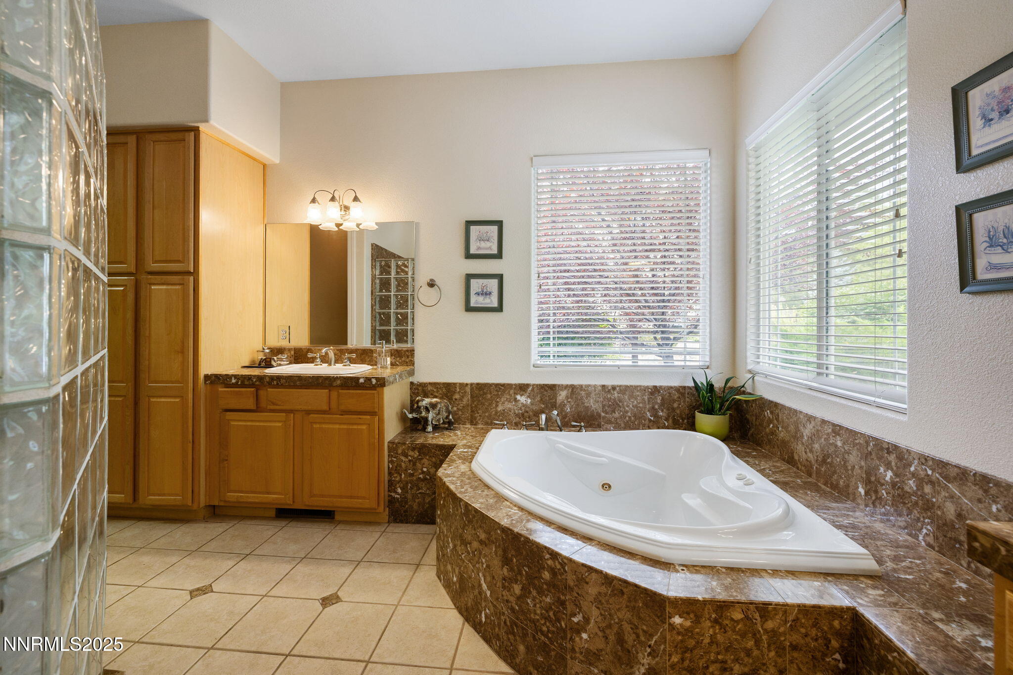 4865 Buckhaven Road Reno, NV 89519 - Photo 26 of 47 a bathroom with a tub sink and a mirror